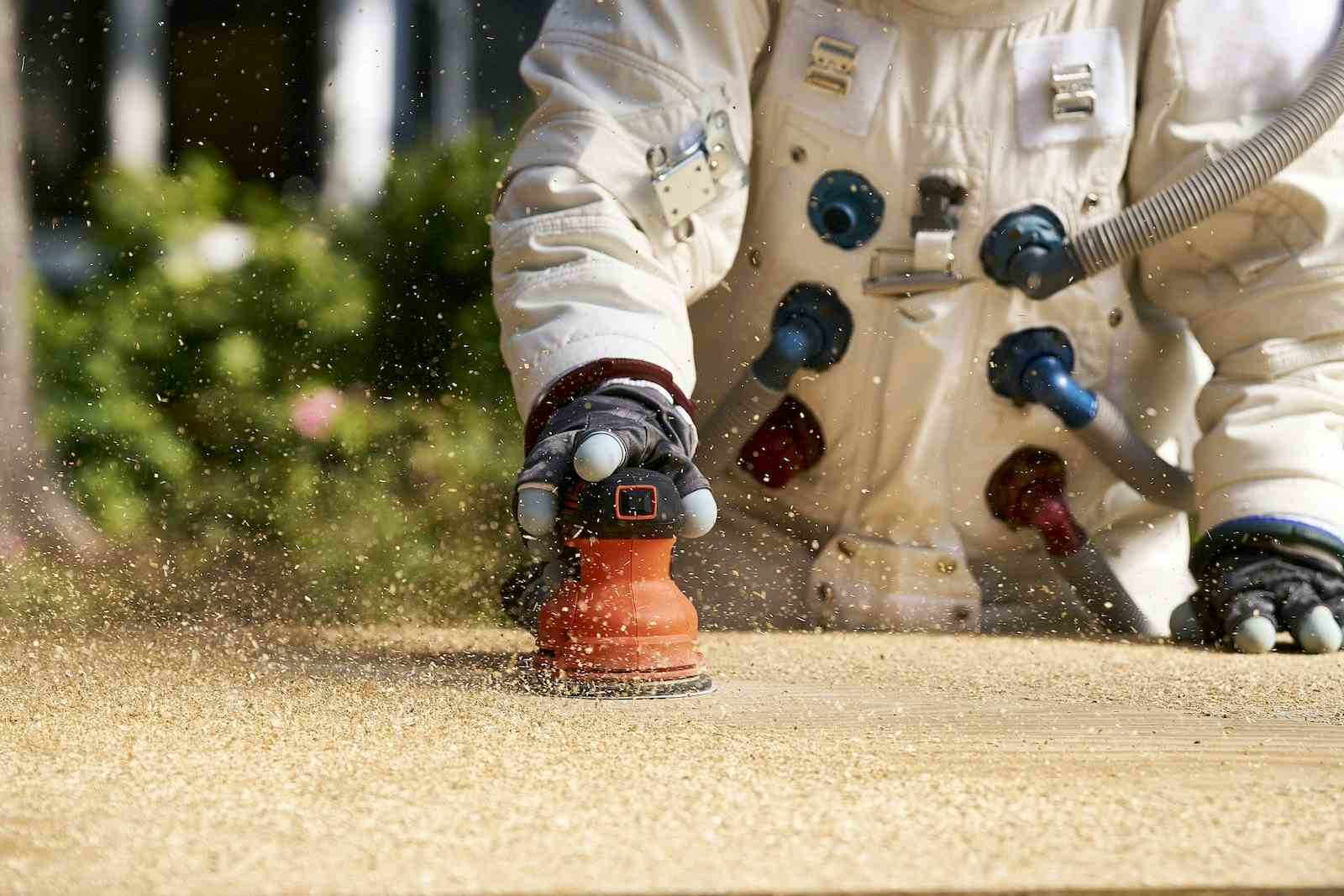 carpenter dressed in space suit